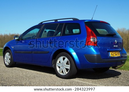 Almere, Flevoland, The Netherlands - March 17, 2015: Metallic Blue Renault Megane Grand Tour II 1.6 16V Tech Line. This model 2005 is the second generation of the popular French family car