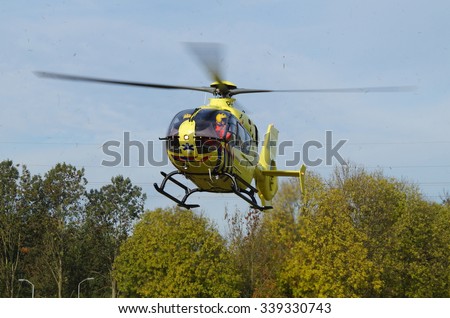 Almere, Flevoland, The Netherlands - October 30, 2015: Dutch Ambulance Helicopter (Lifeliner 1) approaching for landing in the city of Almere Stad (\'t Oor)