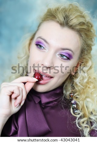 blonde woman with cherry