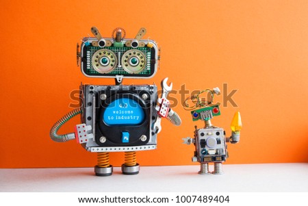 Industry 4.0 concept. Big IT specialist robot with hand wrench and small robotic cyborg. Welcome to the new economic future message on blue display. Orange wall background.