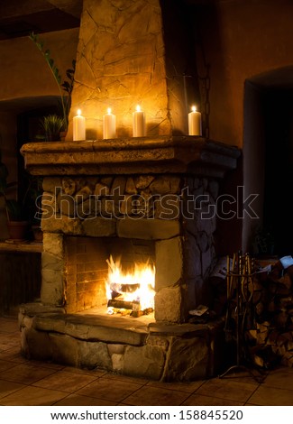 Fireplace Room. Chimney, Candles And Woodpile. Chimney Place. Vintage Style.