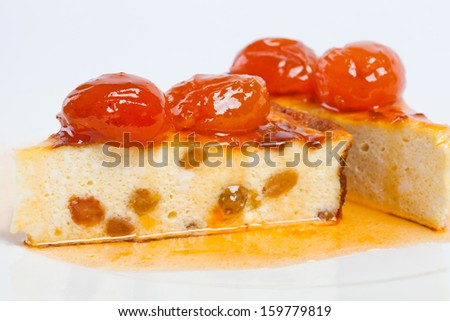 Homemade curd pudding. Dessert cheese cake with apricot jam. Side-view. White background.