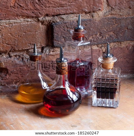 Medical jars with colorful potions on brick wall background. Medicine bottle. Old pharmacy bottles.