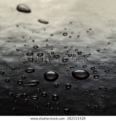 Abstract water drops art. Bubbles black background. Toned photo. macro view, soft focus.