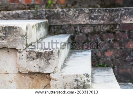 Aged grey stone stairway. hierarchy. stepping stones. side view, soft focus