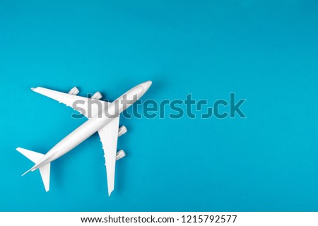 modern plane isolated on blue backdrop. Concept of aircraft industry