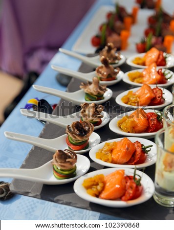 Spoons with seafood snacks -  banquet dish