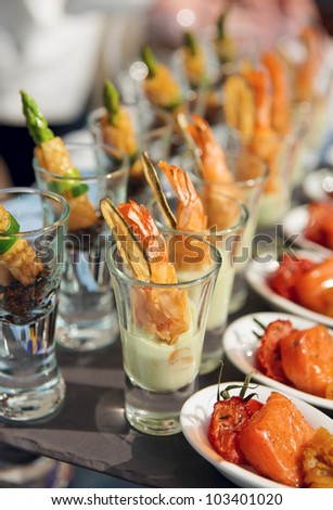 Glasses with seafood snacks -  banquet dish