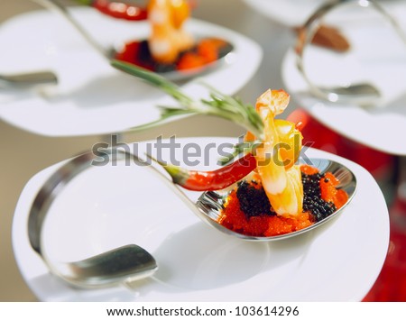 Sun-lit seafood snacks in plate