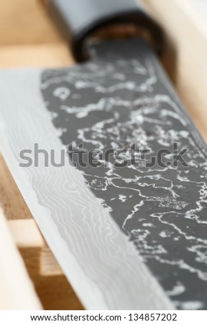 Macro shot of damascus japanese knife blade