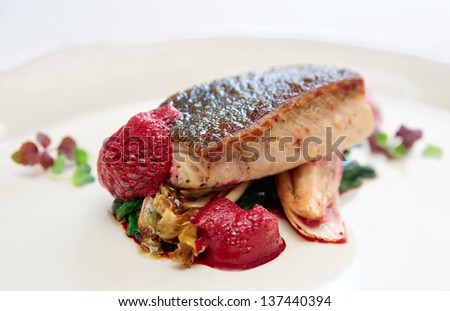 Black cod fillet witt chicory and beetroot juice froth - gourmet dish