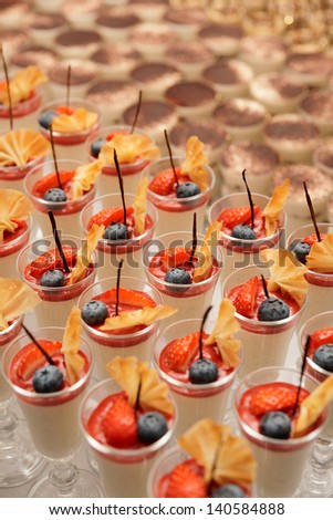 Cream and berry desserts on buffet table