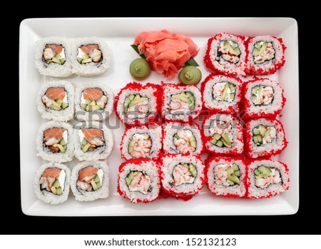 Maki sushi on plate, isolated on black background