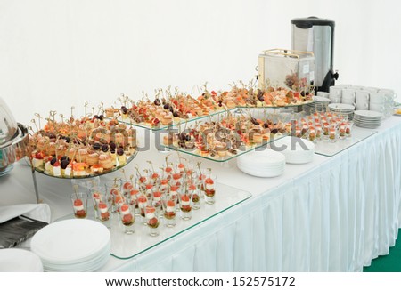 Various meat, fish and cheese banquet snacks on banquet table, catering event
