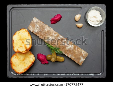 Meat aspic with baked potatoes and horseradish isolated on black, clipping path