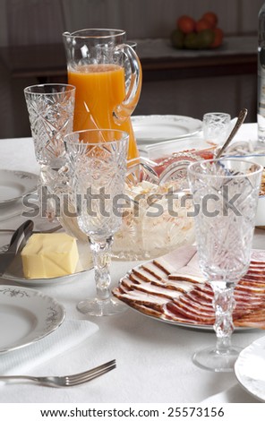 Festive table arrangement with lots of food and crystal