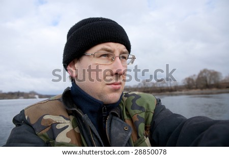 Angry young fisherman - no fish and weather is bad