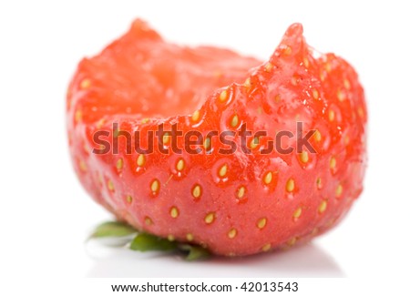 Strawberry with missing bite isolated on white with reflection