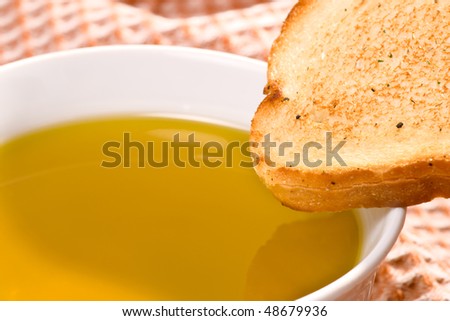Piece of toasted bread and olive oil, closeup