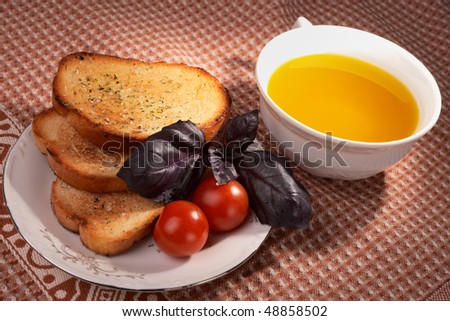Three pieces of toasted bread and cherry tomatoes