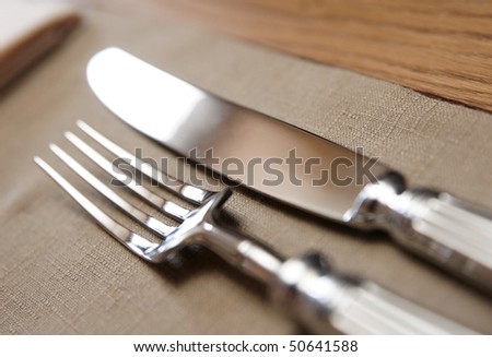 Fork, knife and napkin, very shallow focus