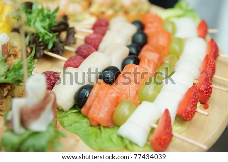 Salmon canapes on restaurant table, narrow focus depth