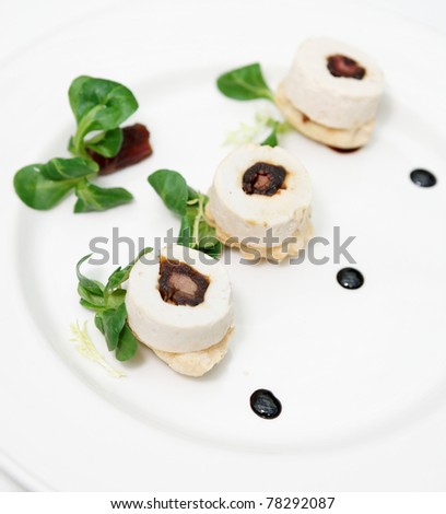 Creative fish dish on white porcelain plate