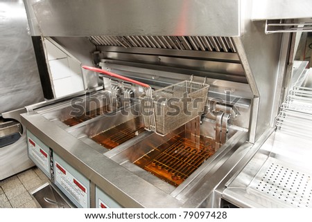 Deep fryer with oil on restaurant kitchen