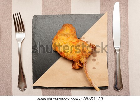Deep fried rack of lamb on slate plate
