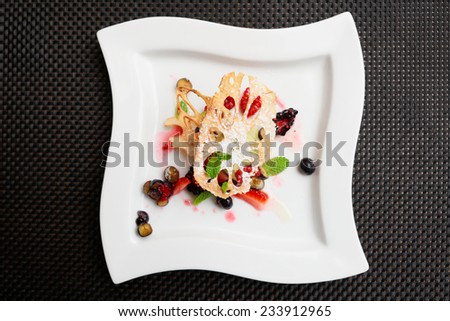Asian fruit dessert with lotus root and berries shot from above