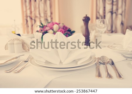 Table arrangement in an expensive haute cuisine restaurant, toned image