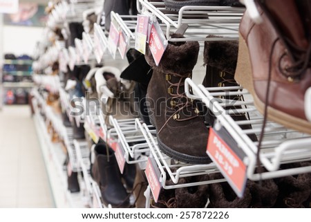 Cheap shoes in a supermarket, labels contain no copyright