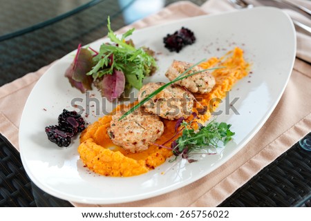 White meat patty cakes with pumpkin mash