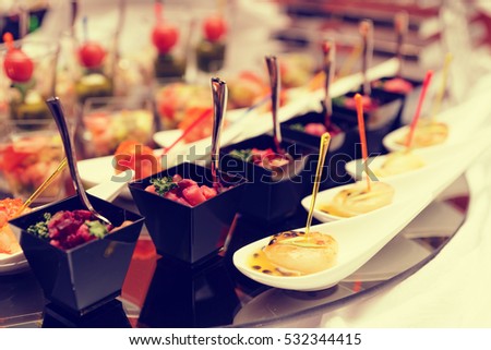 Various snacks on table, banquet food, toned image