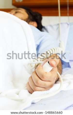 man hand emergency or distress nurse call button
