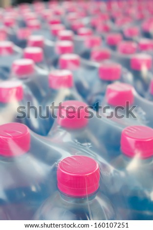 Rows of water bottles in plastic wrap