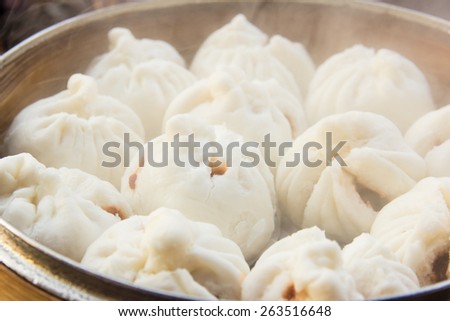 Chinese steamed buns stuffed red pork