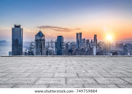 Empty floor with modern skyline and buildings