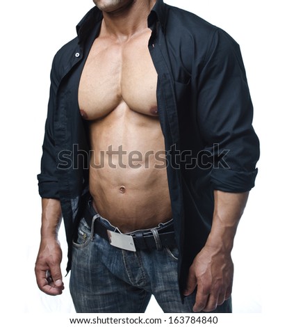 Male bodybuilder in jeans and open shirt revealing really muscular pecs and abs