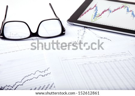 Stock share charts on my office table
