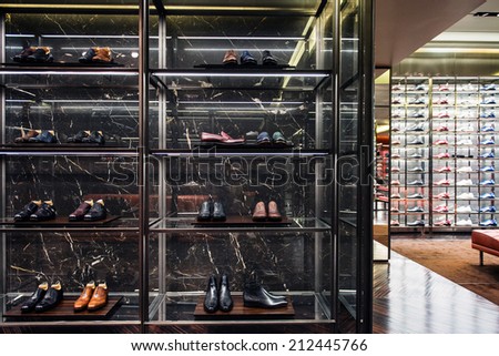 ROME, ITALY  AUGUST 22, 2014: Prada leather shoes in a display cabinet.