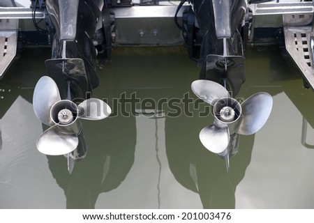 Twin speed boat propellers. Viewed from the stern.