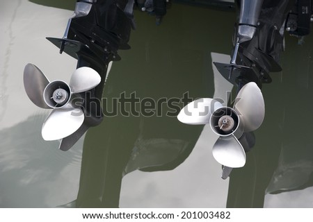 Twin speed boat propellers. Viewed from the stern.