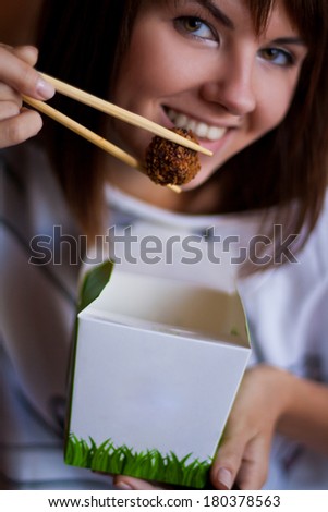 Brunette with blank food package & chopsticks