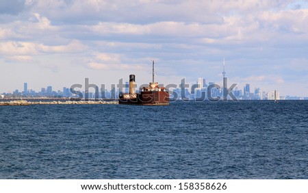Shipwreck and Toronto Skyline Shipwreck with Toronto Skyline background, Port Credit, Ontario, Canada
