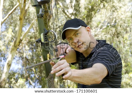 A guy getting ready to shoot his target