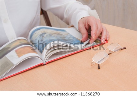 woman studies the art book