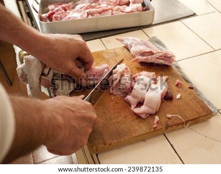 Cutting up a rabbit for cooking