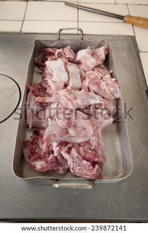 Raw rabbit meat cooking