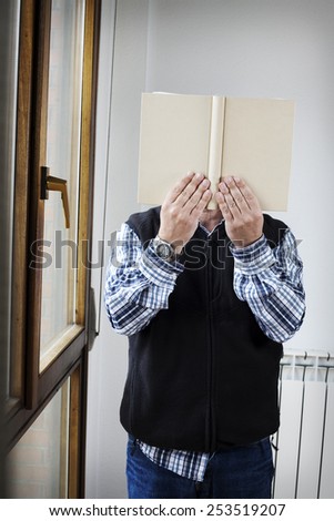 Mature Adult reading without showing your face